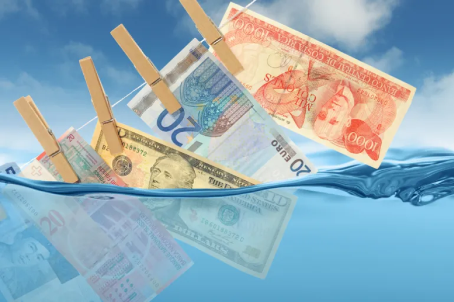 غسل الأموال جريمة تهدد الأنظمة الاقتصادية حول العالم (غيتي) 